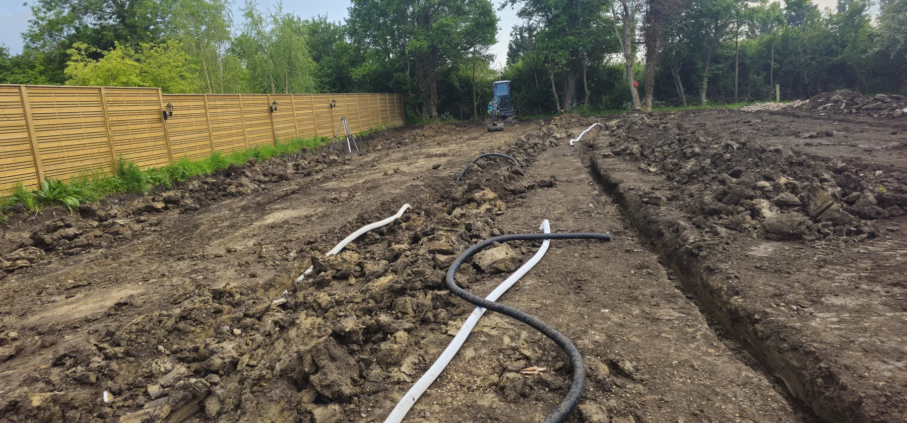 Deep ground preparation and drainage pipe installation